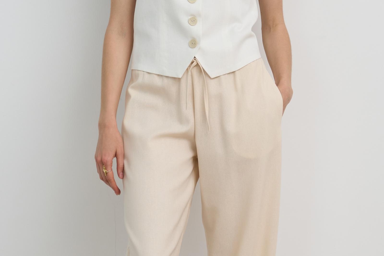 Брюки-балон на резинці кольору ваніль